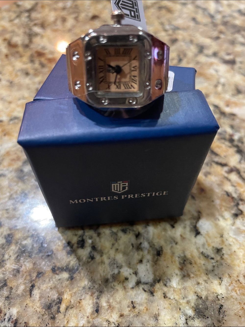 Montres Prestige Womenโs Silver Ring Watch with Beige Dial